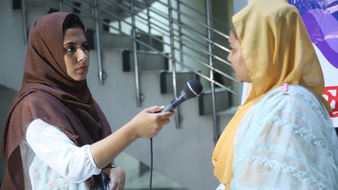Female journalist interviewing